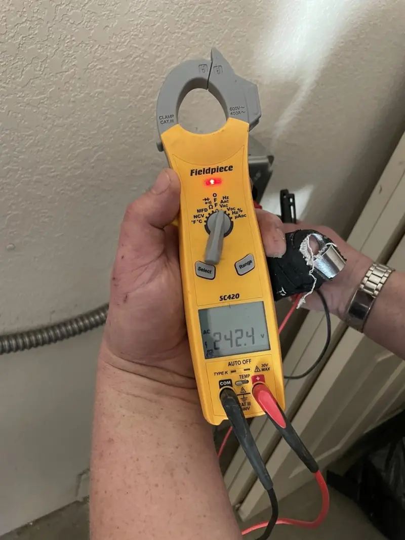 Voltage testing with clamp meter during Circuit Breaker Repair in White